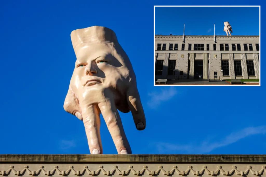 Nightmare-inducing - and beloved - hand statue bids farewell after 'disturbing' the public for years